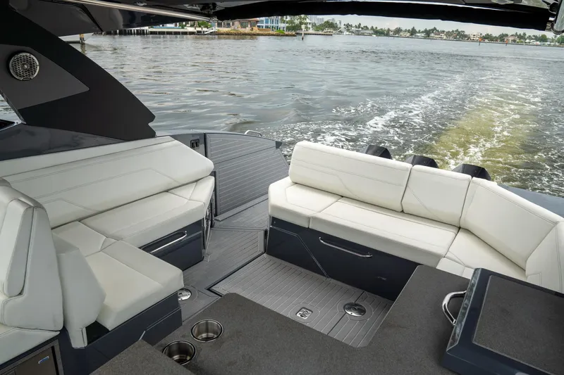 Di Blue Yacht Photos Pics 2022 Cruisers Yachts 38 GLS interior with white seating, overlooking water.
