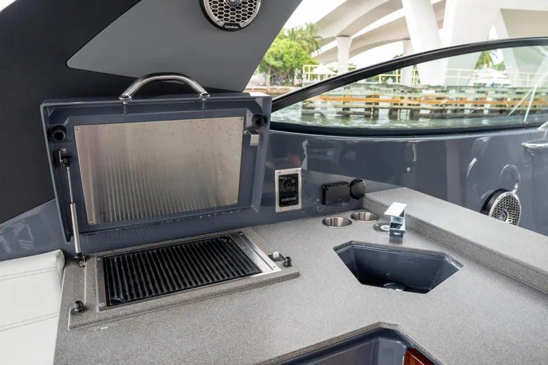 Di Blue Yacht Photos Pics Outdoor kitchen area on 2022 Cruisers Yachts 38 GLS, featuring a grill and sink.