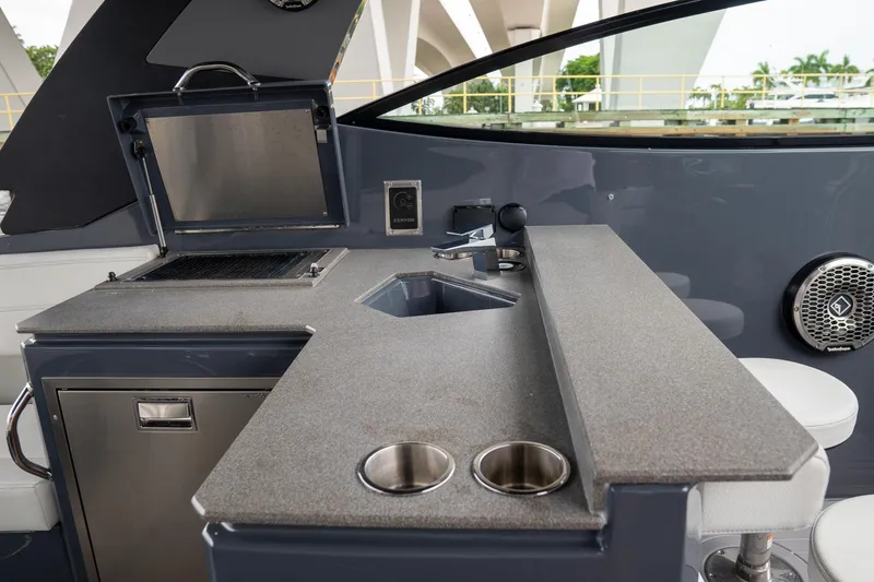 Di Blue Yacht Photos Pics 2022 Cruisers Yachts 38 GLS interior with sleek kitchenette and modern amenities.