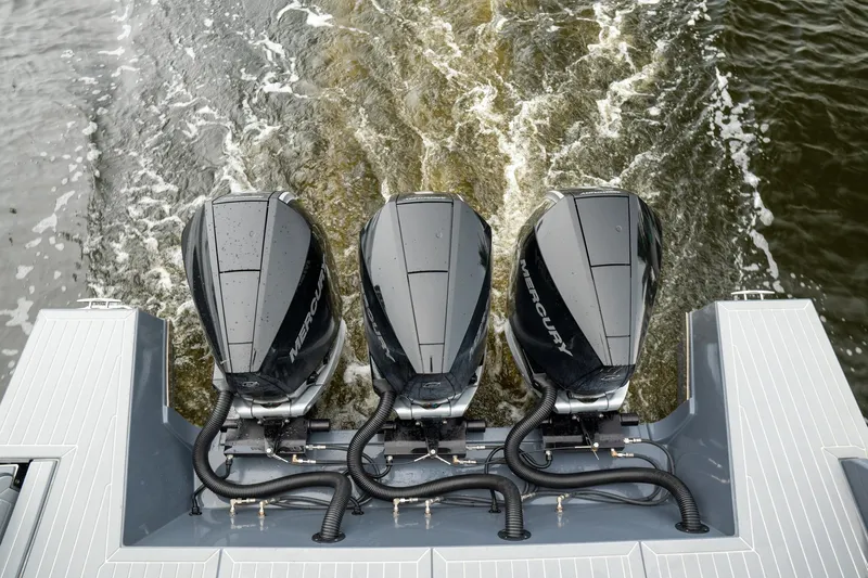 Di Blue Yacht Photos Pics Triple Mercury outboard engines on 2022 Cruisers Yachts 38 GLS, cruising through water.