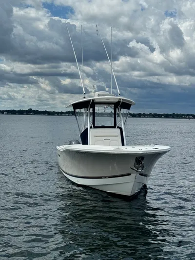  Yacht Photos Pics 2015 Regulator 25 boat on water under cloudy sky.