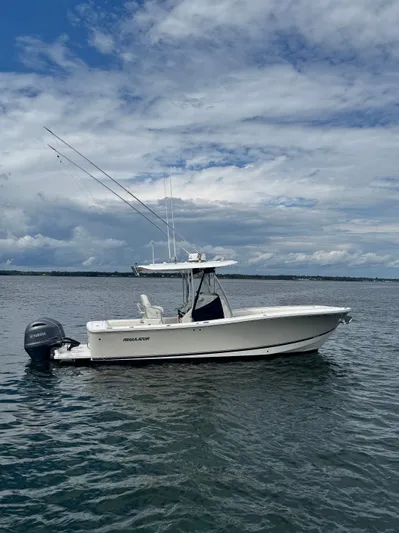  Yacht Photos Pics 2015 Regulator 25 boat on water under cloudy sky.
