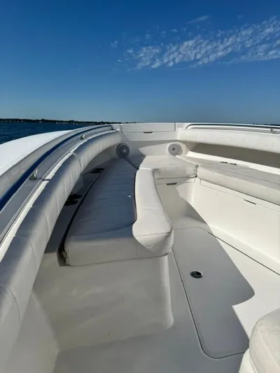  Yacht Photos Pics 2015 Regulator 25 boat interior with white seating and clear blue sky.