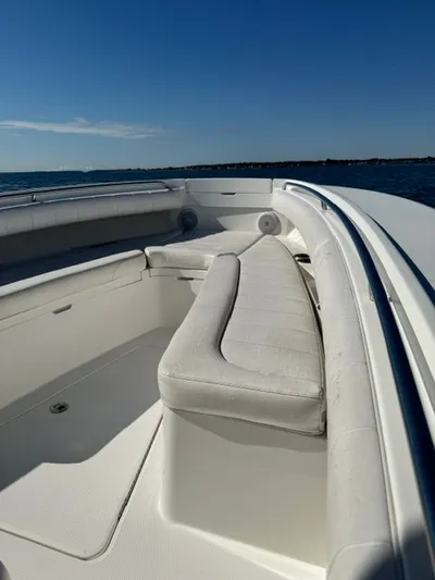  Yacht Photos Pics 2015 Regulator 25 boat interior with white seating, ocean view.