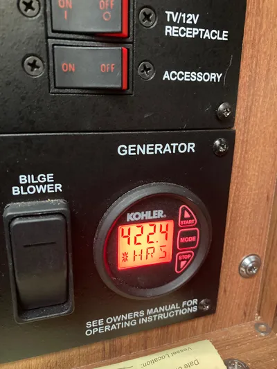  Yacht Photos Pics Control panel of a 2016 Sea Ray 330 Sundancer showing 424 generator hours.