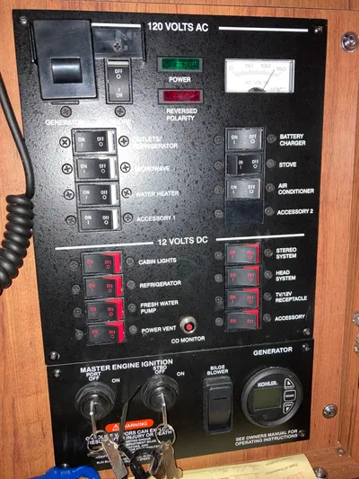  Yacht Photos Pics Control panel of a 2016 Sea Ray 330 Sundancer boat, featuring various switches and indicators.