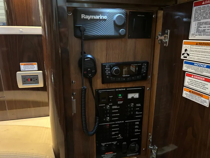  Yacht Photos Pics 2016 Sea Ray 330 Sundancer control panel with Raymarine equipment and various switches.