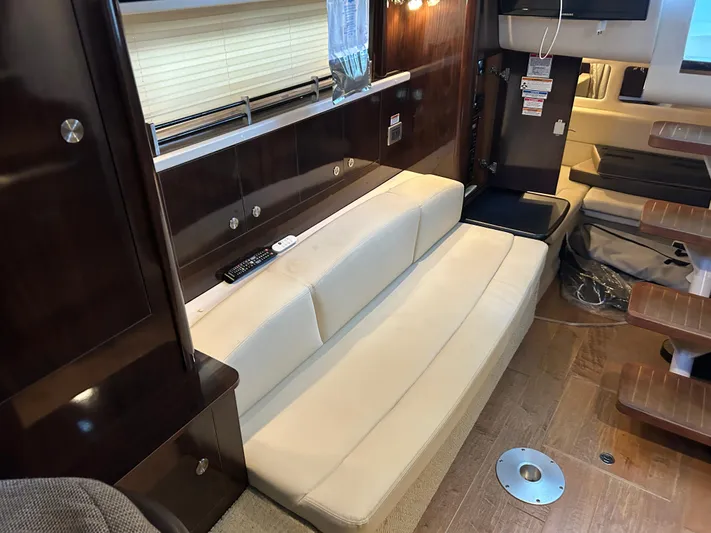  Yacht Photos Pics Interior of 2016 Sea Ray 330 Sundancer with beige seating and wooden accents.