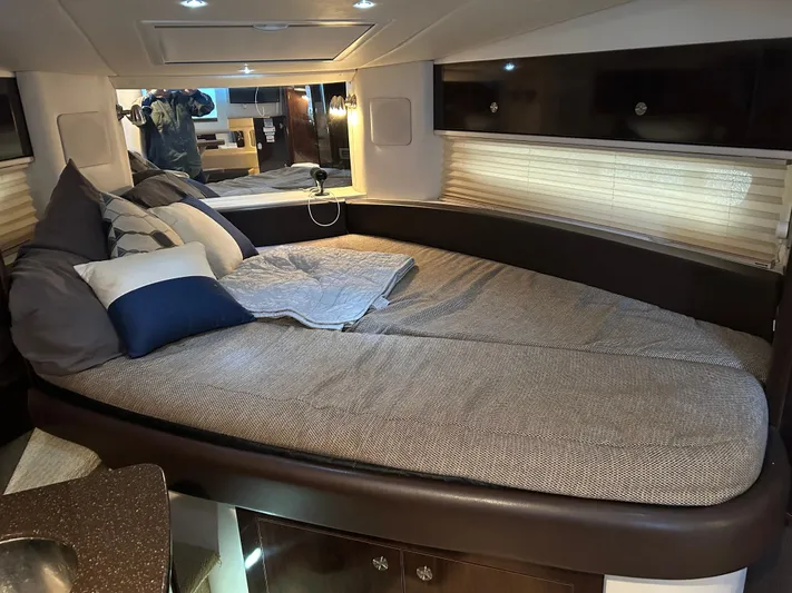  Yacht Photos Pics Luxurious interior cabin of 2016 Sea Ray 330 Sundancer yacht with cozy bedding.