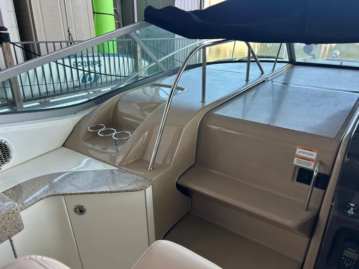  Yacht Photos Pics 2016 Sea Ray 330 Sundancer cockpit with beige interior and cup holders.