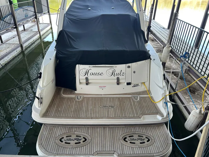  Yacht Photos Pics 2016 Sea Ray 330 Sundancer docked, covered, with "House Rulz" on the stern.