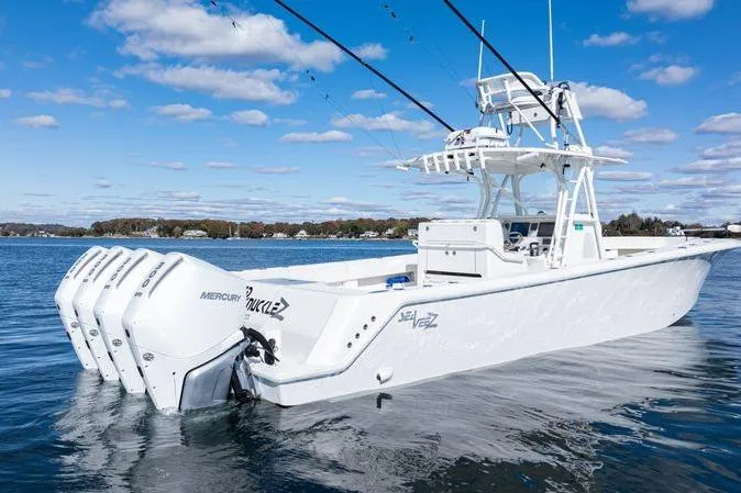  Yacht Photos Pics 2016 SeaVee 390Z boat with multiple Mercury engines on calm water.