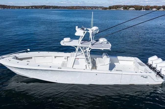  Yacht Photos Pics 2016 SeaVee 390Z boat on calm blue water, showcasing sleek design and spacious deck.