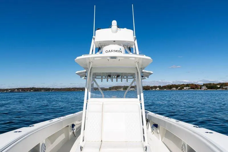  Yacht Photos Pics 2016 SeaVee 390Z boat on calm water under clear blue sky.