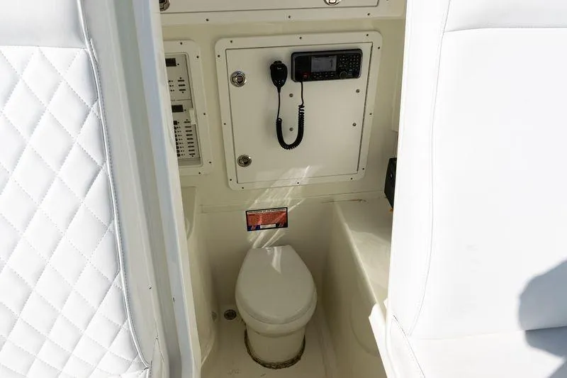  Yacht Photos Pics 2016 SeaVee 390Z boat interior with toilet and communication equipment.
