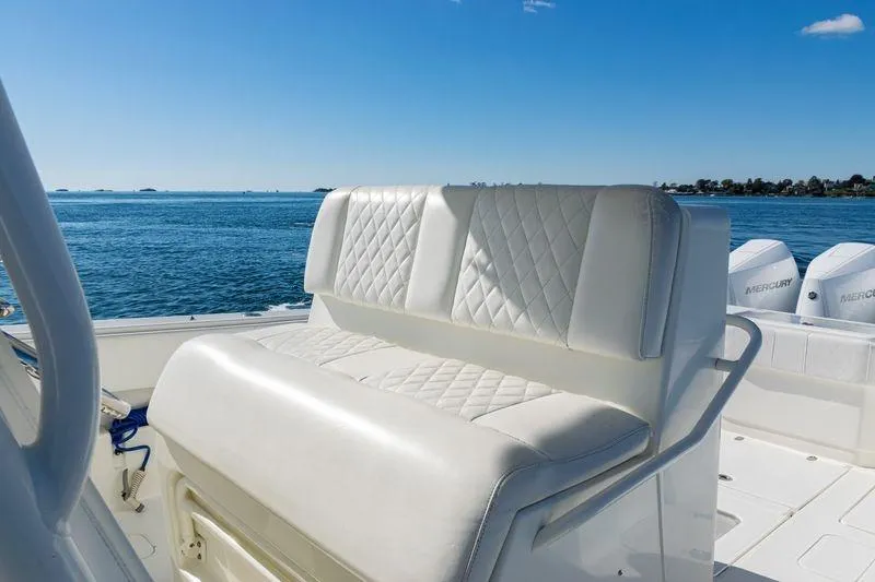 Yacht Photos Pics 2016 SeaVee 390Z boat with white cushioned seating, ocean view, and Mercury engines.