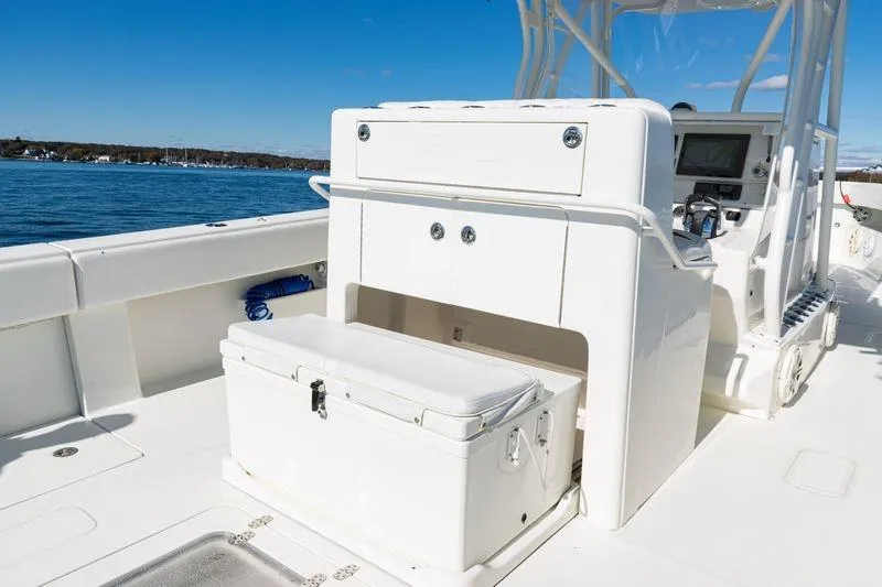  Yacht Photos Pics 2016 SeaVee 390Z boat interior with storage and seating, on a sunny day by the water.