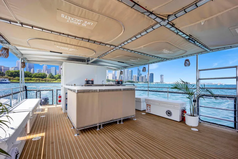  Yacht Photos Pics Luxurious 2026 A&M Manufacturing COI boat deck with city skyline and waterfront views.