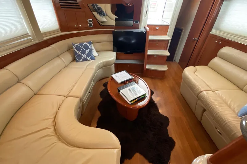 Club Level Yacht Photos Pics Luxurious interior of 2002 Sea Ray 480 Motor Yacht with plush seating and elegant decor.