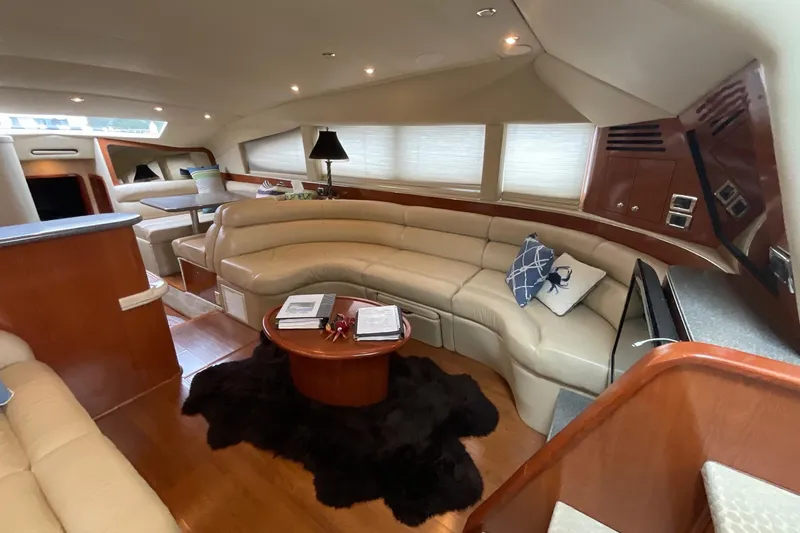 Club Level Yacht Photos Pics Luxurious interior of 2002 Sea Ray 480 Motor Yacht with plush seating and elegant decor.