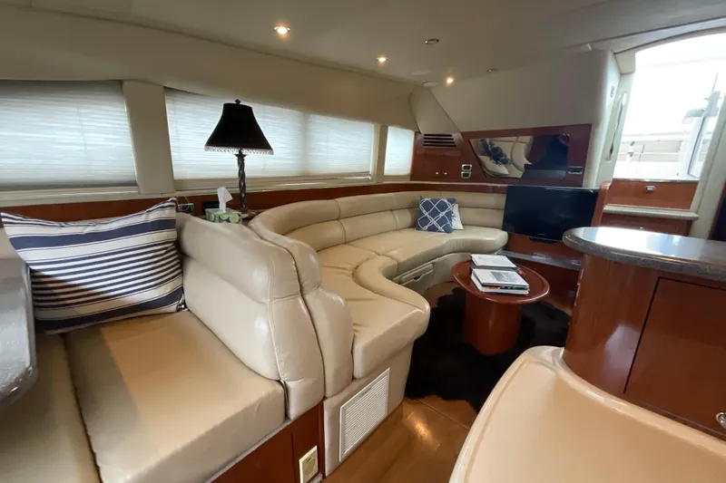 Club Level Yacht Photos Pics Luxurious interior of 2002 Sea Ray 480 Motor Yacht with plush seating and modern decor.