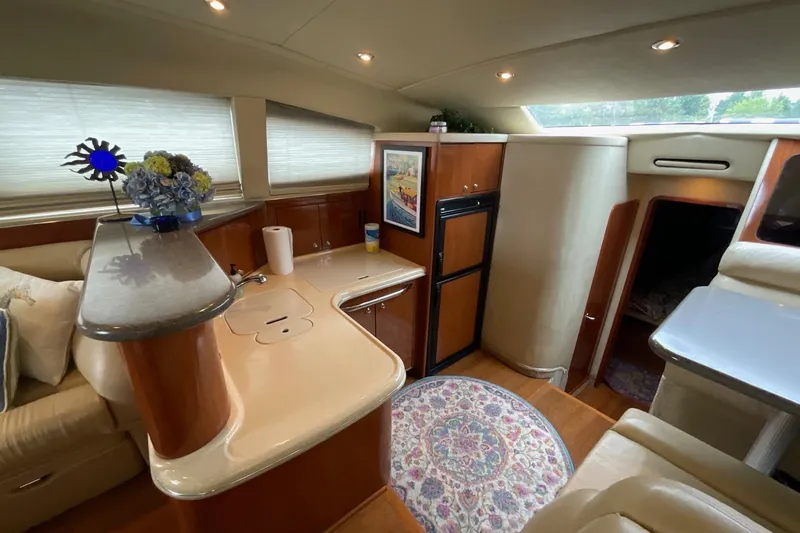 Club Level Yacht Photos Pics Luxurious 2002 Sea Ray 480 Motor Yacht interior with elegant kitchen and cozy seating area.