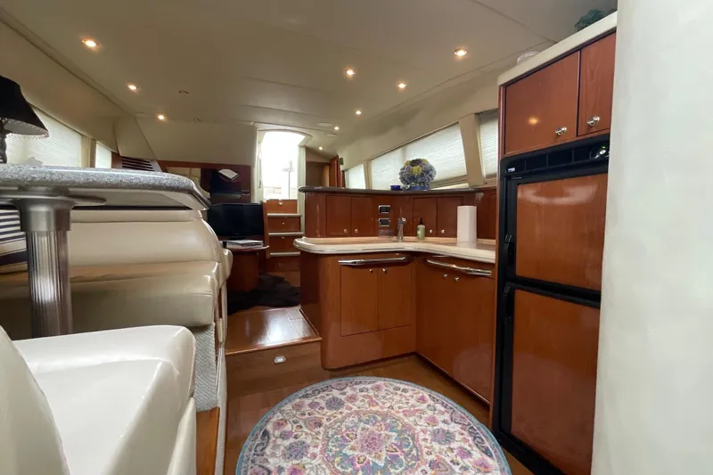 Club Level Yacht Photos Pics Luxurious interior of 2002 Sea Ray 480 Motor Yacht with elegant wood cabinetry.