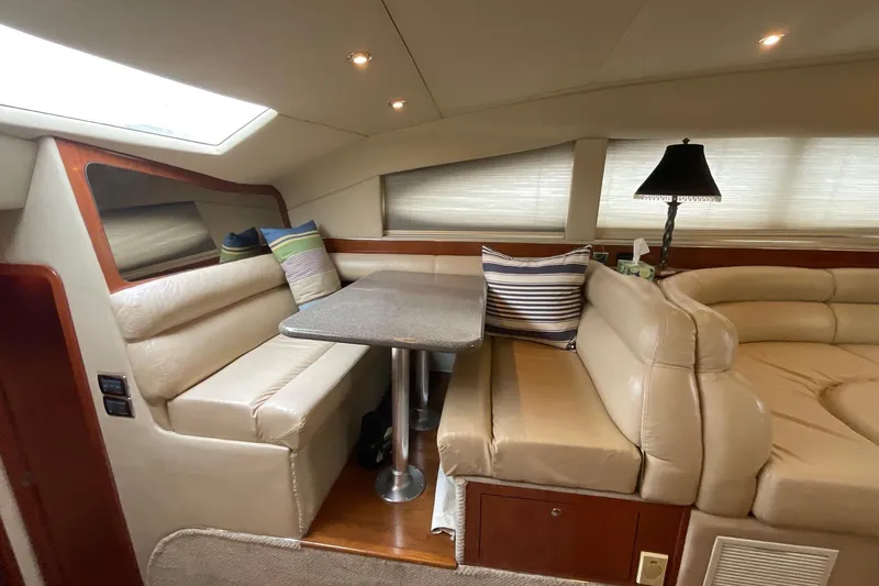 Club Level Yacht Photos Pics Luxurious interior of 2002 Sea Ray 480 Motor Yacht with plush seating and dining area.