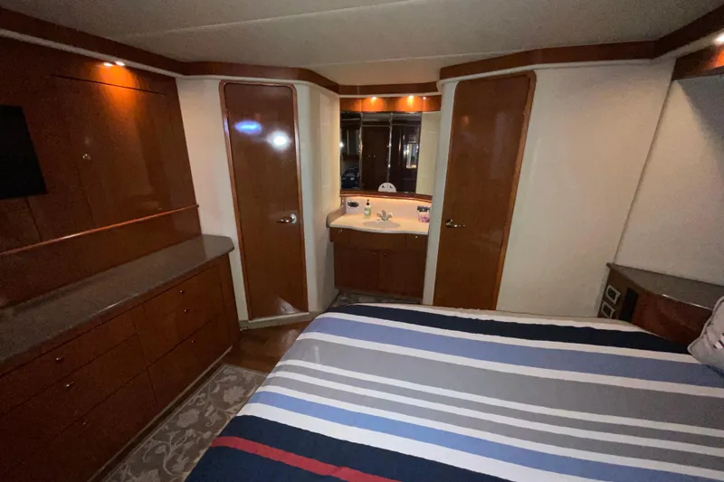 Club Level Yacht Photos Pics Luxurious cabin interior of 2002 Sea Ray 480 Motor Yacht with wood finishes.