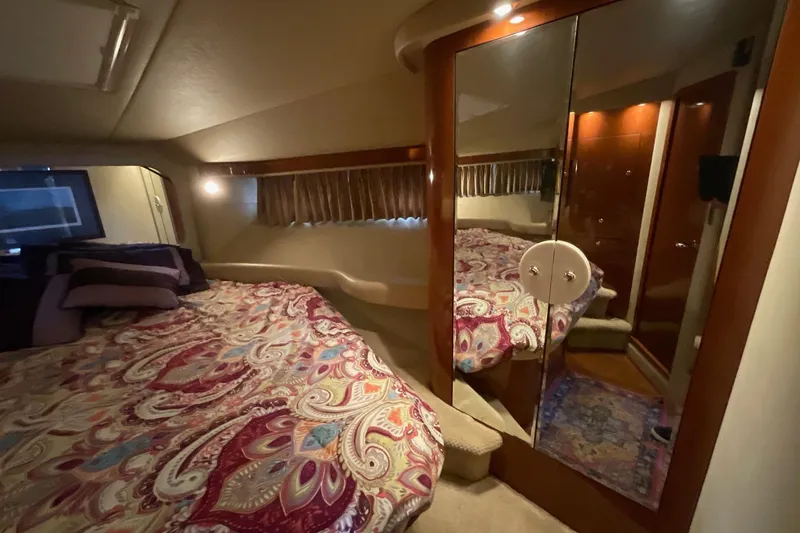 Club Level Yacht Photos Pics Luxurious bedroom interior of 2002 Sea Ray 480 Motor Yacht with mirrored closet.