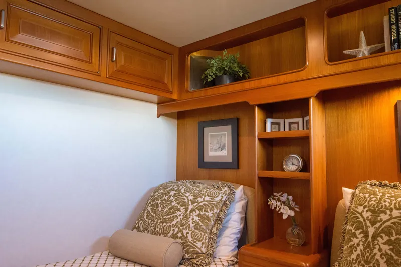  Yacht Photos Pics Luxurious cabin interior of 2013 Fleming 55 yacht with elegant wood finish and decor.