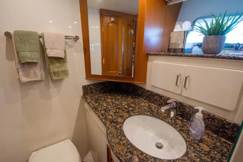  Yacht Photos Pics Luxurious bathroom in 2013 Fleming 55 yacht with granite countertop and modern fixtures.