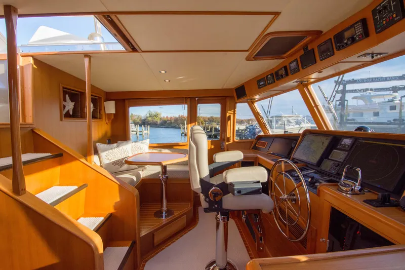  Yacht Photos Pics Luxurious 2013 Fleming 55 yacht interior with helm, seating, and panoramic windows.