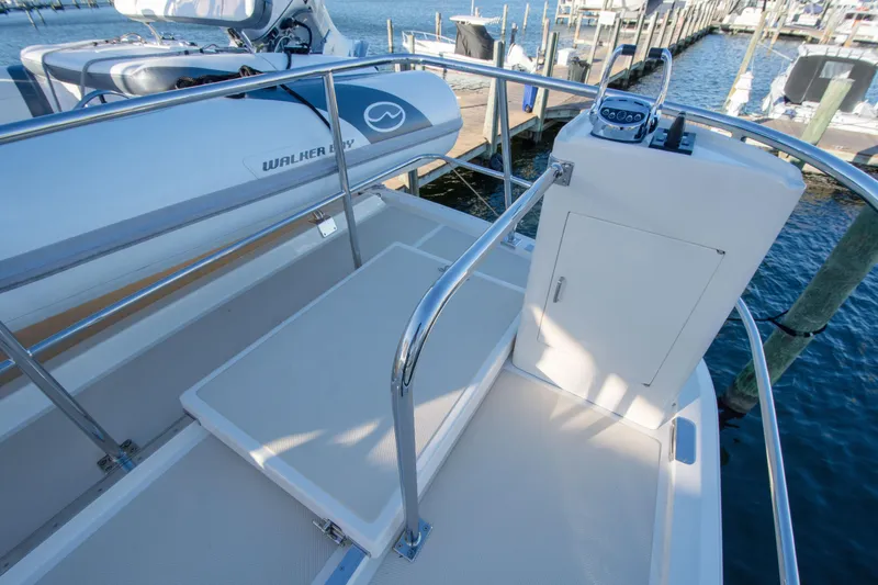  Yacht Photos Pics 2013 Fleming 55 yacht deck with Walker Bay dinghy, docked at marina.