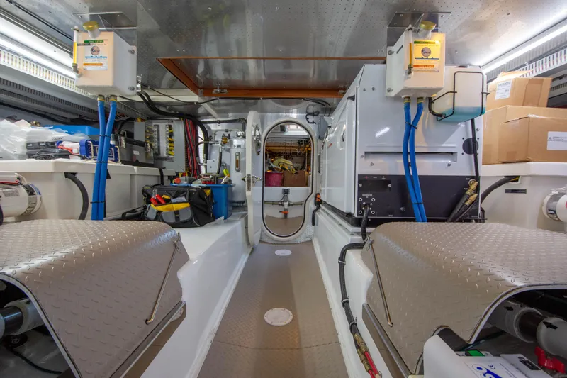  Yacht Photos Pics Engine room of a 2013 Fleming 55 yacht, featuring equipment and storage areas.