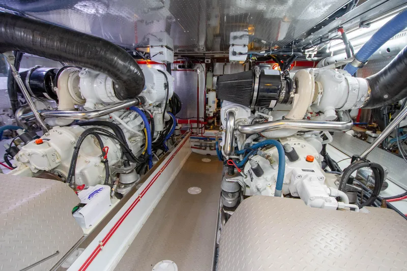  Yacht Photos Pics Engine room of a 2013 Fleming 55 yacht, showcasing dual engines and mechanical systems.