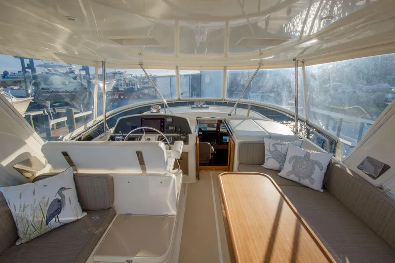  Yacht Photos Pics Luxurious interior of 2013 Fleming 55 yacht with elegant seating and helm.
