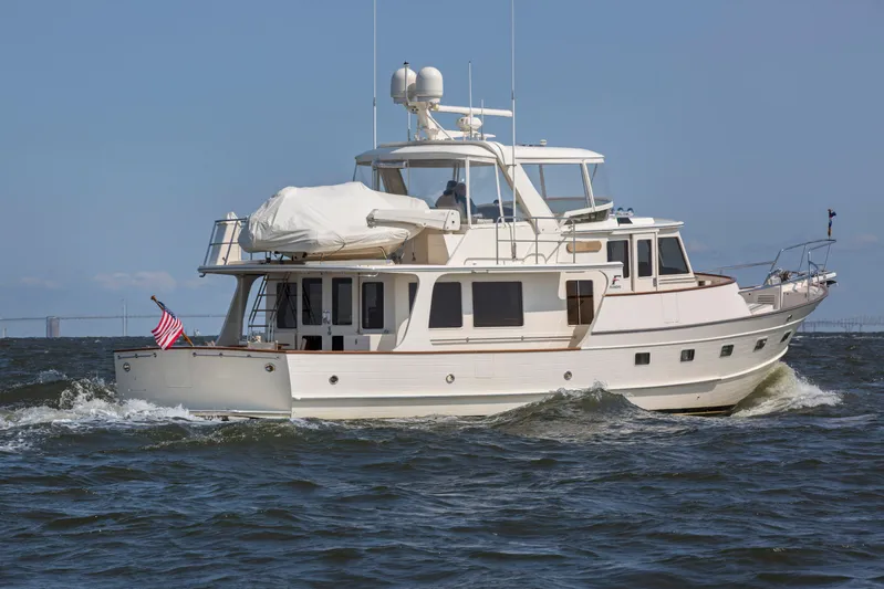  Yacht Photos Pics 2013 Fleming 55 yacht cruising on open water under clear skies.