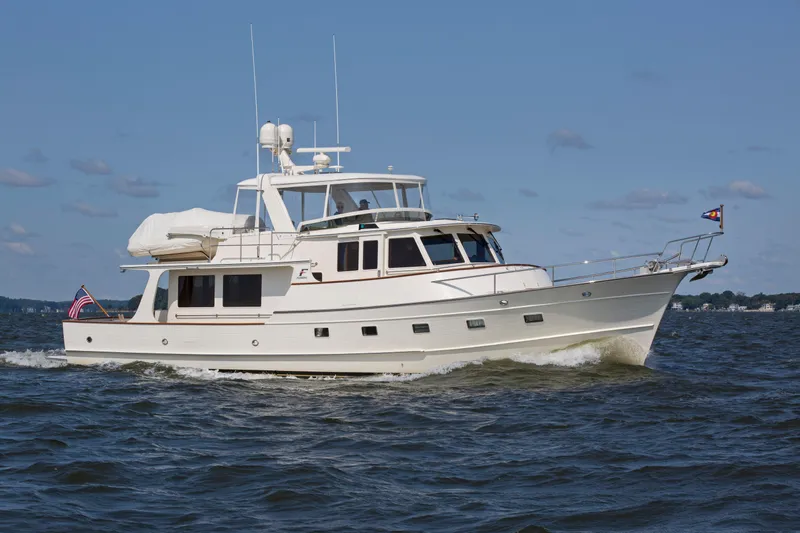  Yacht Photos Pics 2013 Fleming 55 yacht cruising on open water under clear skies.