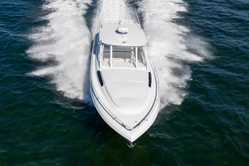  Yacht Photos Pics 2016 Intrepid 400 Cuddy cruising swiftly on open water.