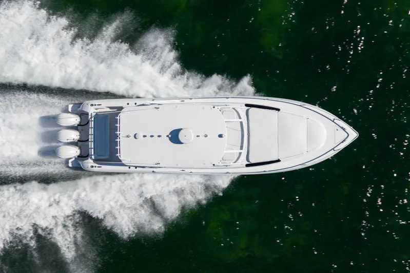  Yacht Photos Pics Aerial view of 2016 Intrepid 400 Cuddy boat speeding on water.