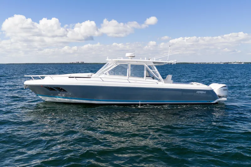  Yacht Photos Pics 2016 Intrepid 400 Cuddy boat on open water under blue sky.