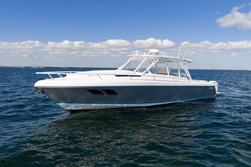  Yacht Photos Pics 2016 Intrepid 400 Cuddy boat on open water under a clear blue sky.