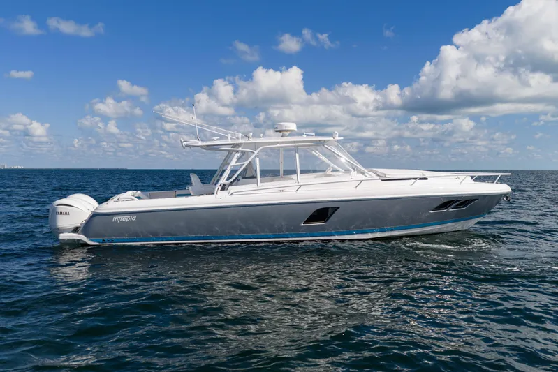  Yacht Photos Pics 2016 Intrepid 400 Cuddy boat cruising on open water under a clear blue sky.