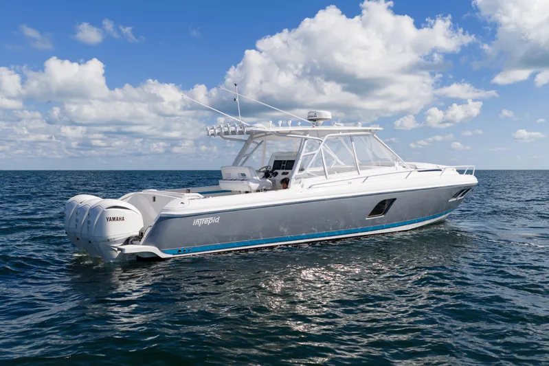 Yacht Photos Pics 2016 Intrepid 400 Cuddy boat on open water under a blue sky.