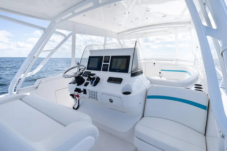 Yacht Photos Pics 2016 Intrepid 400 Cuddy boat interior with modern helm and ocean view.
