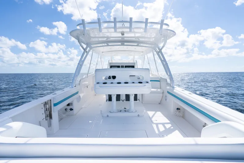  Yacht Photos Pics 2016 Intrepid 400 Cuddy boat on open sea under clear blue sky.