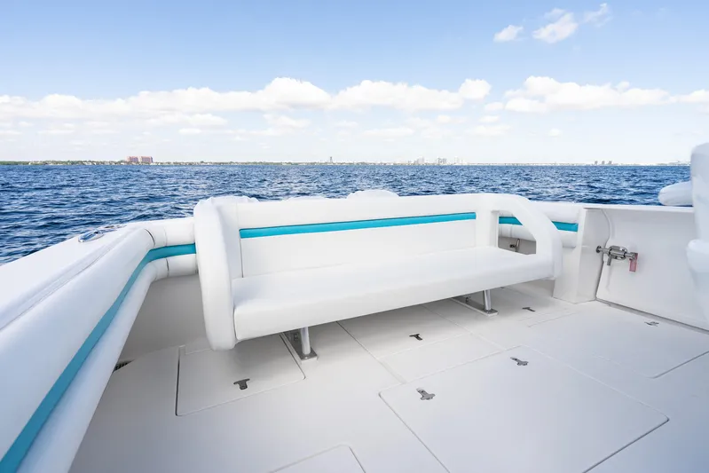  Yacht Photos Pics 2016 Intrepid 400 Cuddy boat with white seating, ocean view, and clear sky.