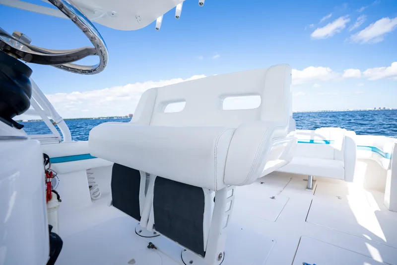  Yacht Photos Pics 2016 Intrepid 400 Cuddy boat interior with white seating and ocean view.