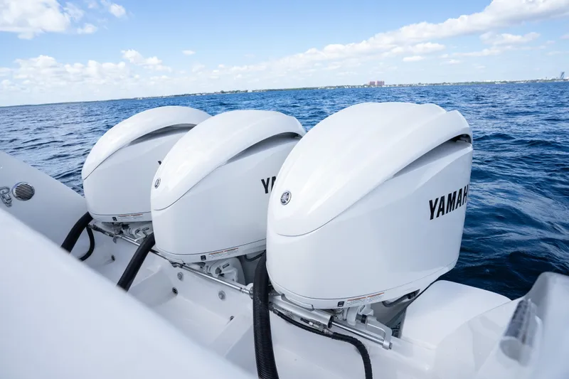  Yacht Photos Pics Triple Yamaha outboard engines on a 2016 Intrepid 400 Cuddy boat, cruising on open water.